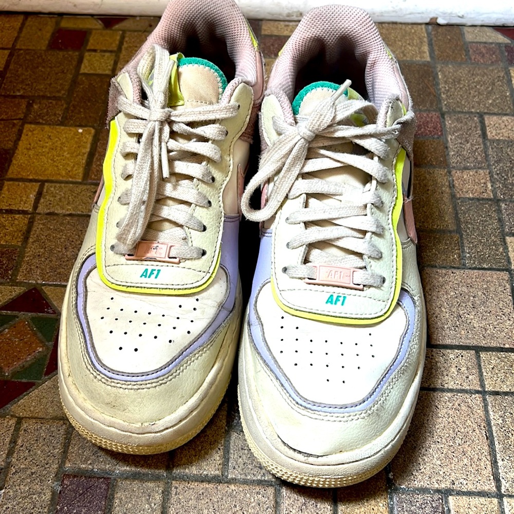 Nike Air size 9. Used yellow, lavender purple